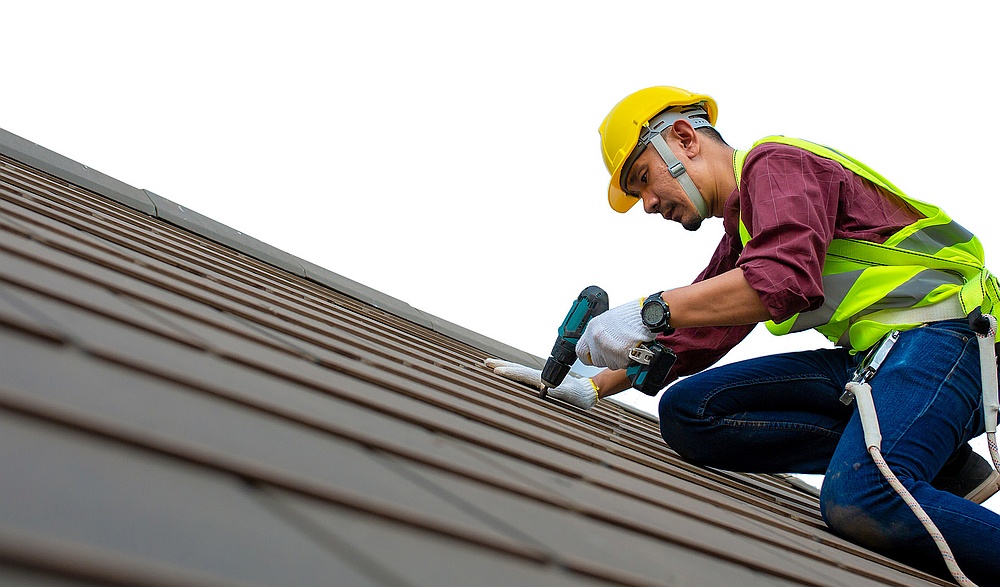 roofing contractor working on roof